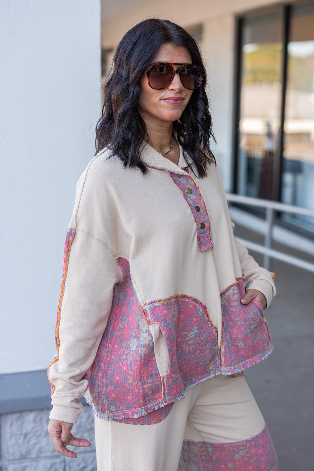 Women's french terry knit oatmeal pullover top with frayed floral patch gauze details by Easel showing side view