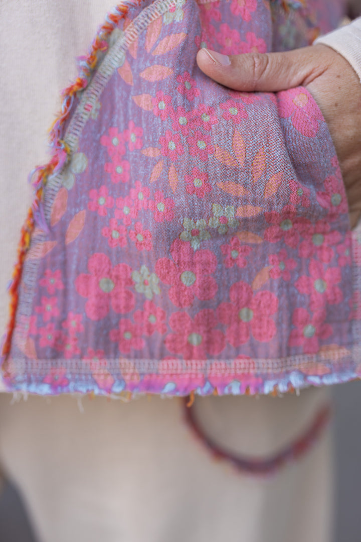 Women's french terry knit oatmeal pullover top with frayed floral patch gauze details by Easel showing up close look at floral pattern