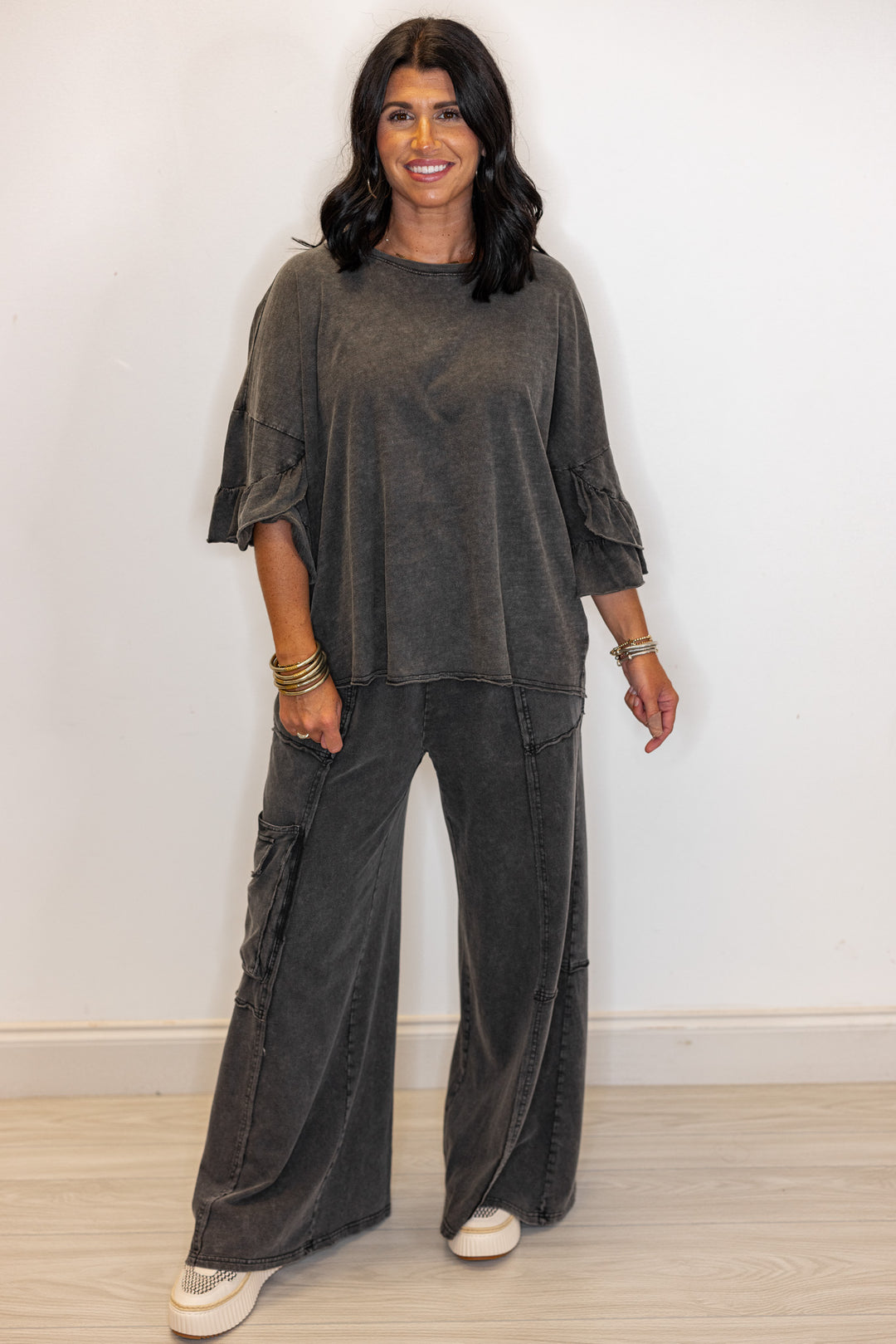Women's mineral washed black slub top with ruffle trimmed sleeves by Easel showing full front view