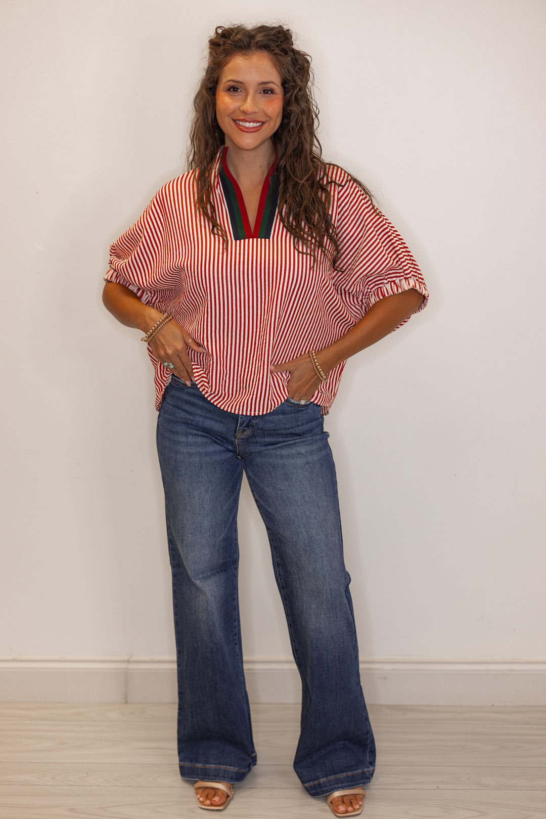 Women's brick red striped short sleeve top with color block detailed v neckline