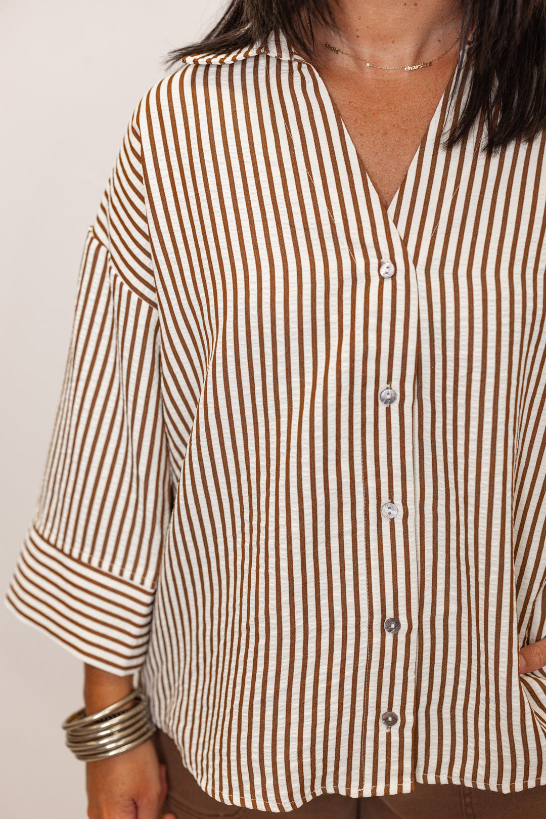 Women's brown and ivory striped button up top