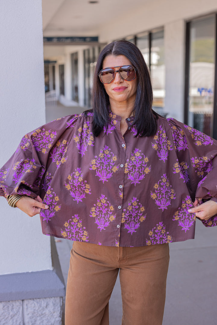 Women's chocolate brown button front poplin top with orange and purple florals by Entro showing true to size fit
