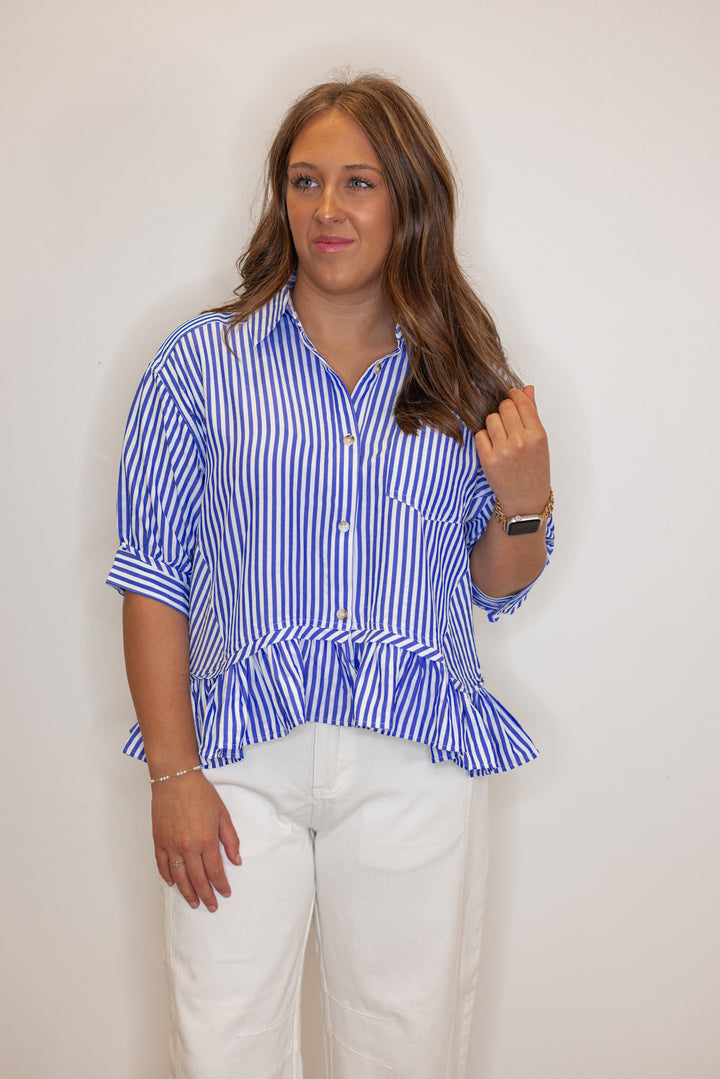 Women's blue summer striped button down top with ruffled bottom hem by Entro