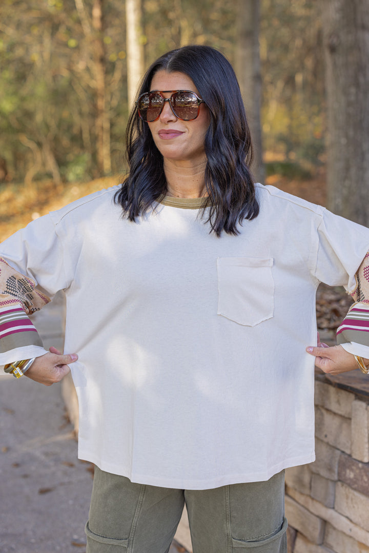 Women's washed ecru knit top with striped trim and floral details at the sleeves by Easel showing true to size fit