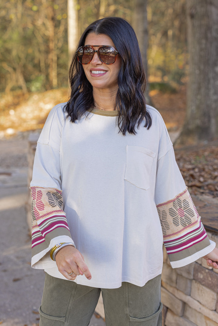 Women's washed ecru knit top with striped trim and floral details at the sleeves by Easel