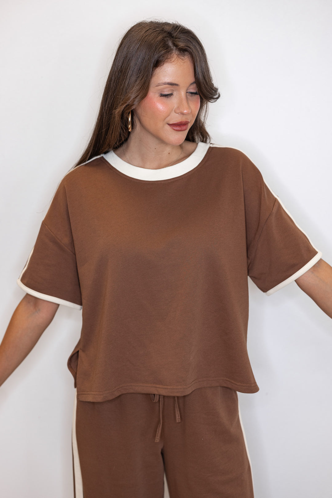 Women's brown french terry knit top with cream stripes on the sleeve by Entro showing up close front view