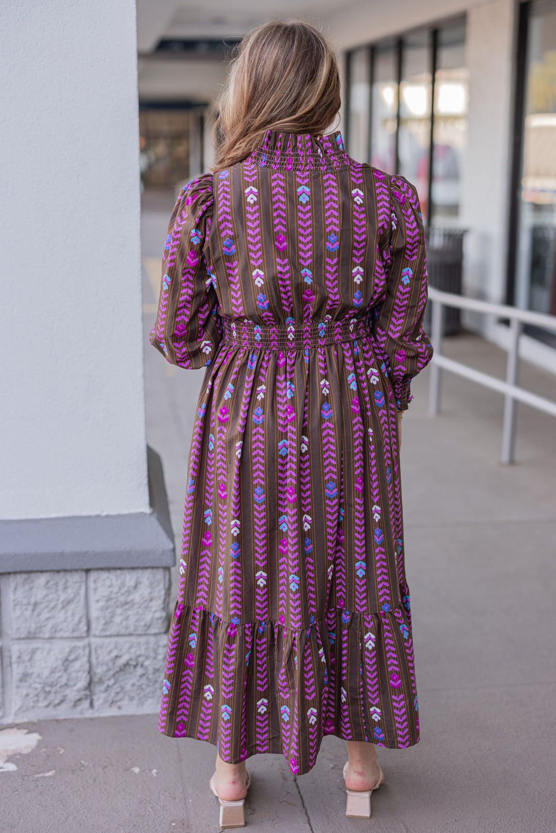 Women's brown ruffle trimmed midi dress with pink multicolor petal print by Umgee showing full back view