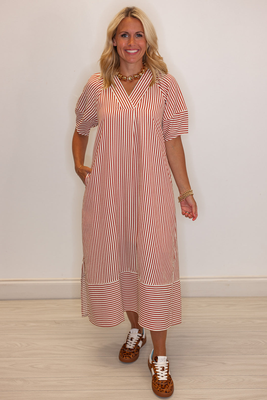 Women's rust and ivory striped midi dress by Entro showing full front view