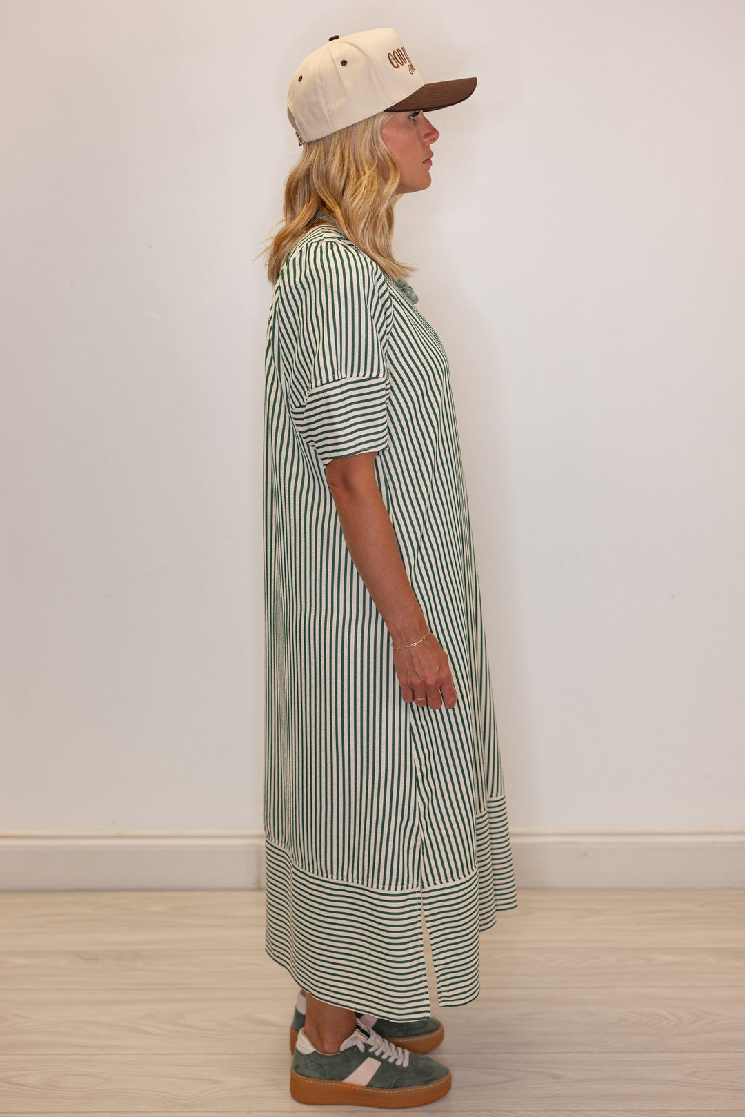 Women's hunter green and ivory striped midi dress by Entro showing side view