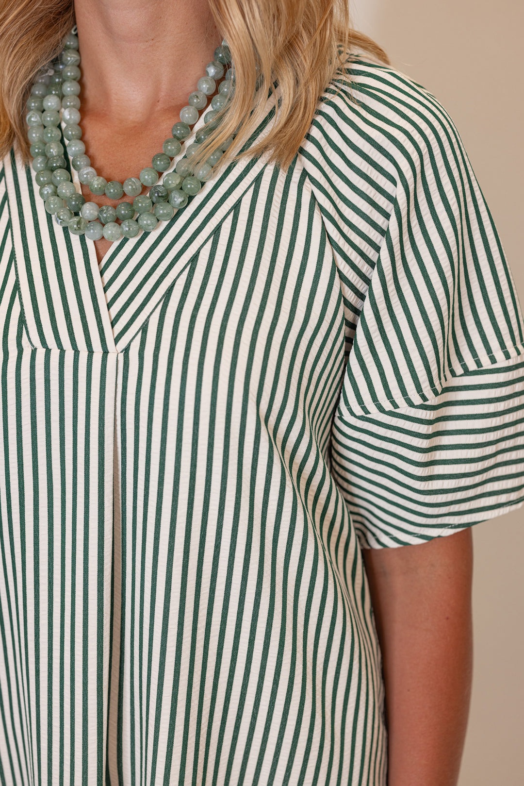 Women's hunter green and ivory striped midi dress by Entro showing striped pattern detail