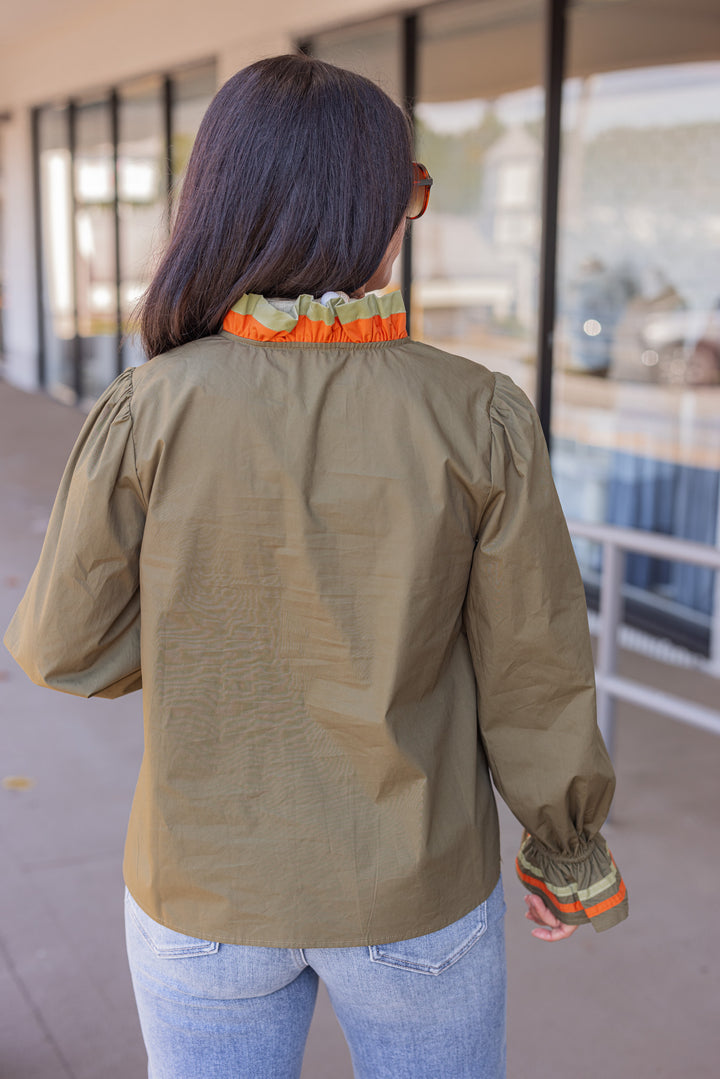 Women's olive poplin top with orange and light olive trim by Jodifl showing back view