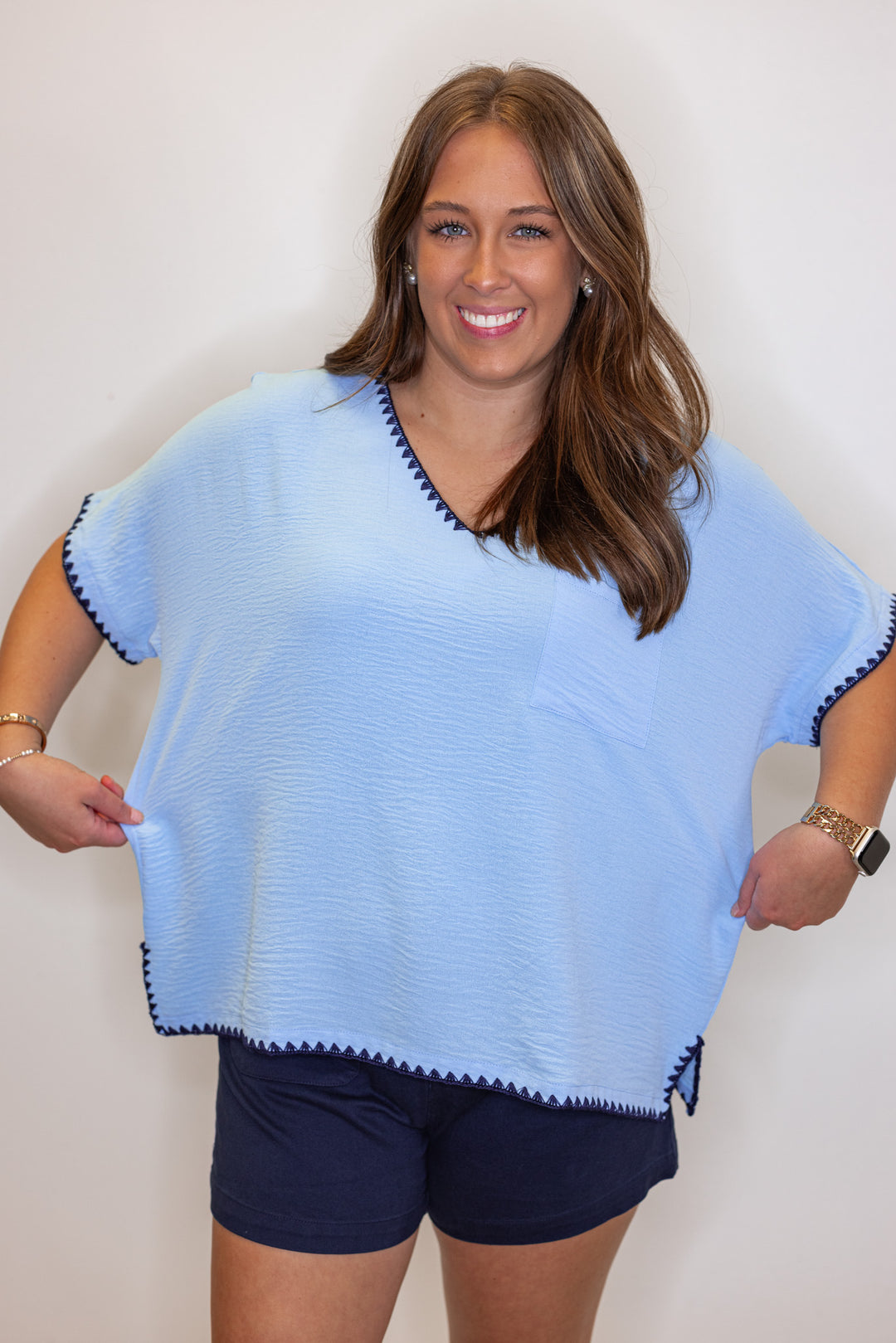 Sky blue lightweight crinkle top with embroidery stitching trim by Jodifl showing tops width