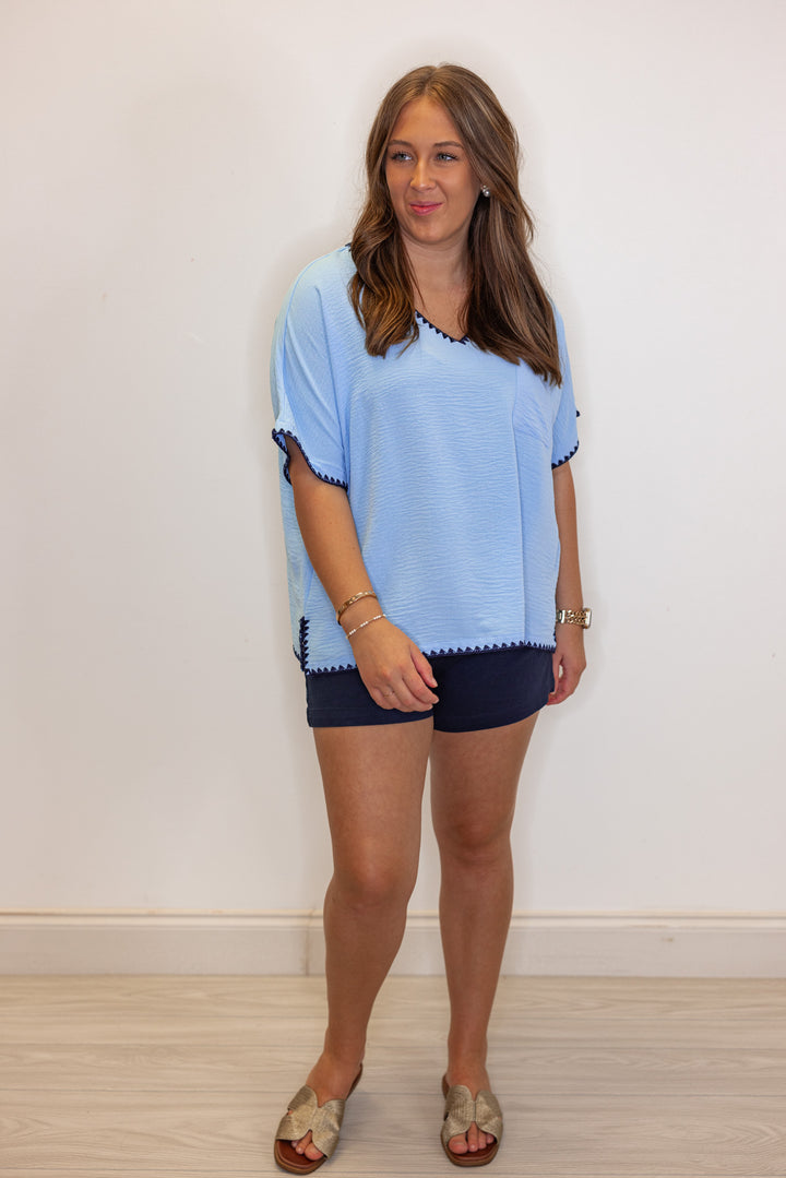 Sky blue lightweight crinkle top with embroidery stitching trim by Jodifl showing relaxed fit