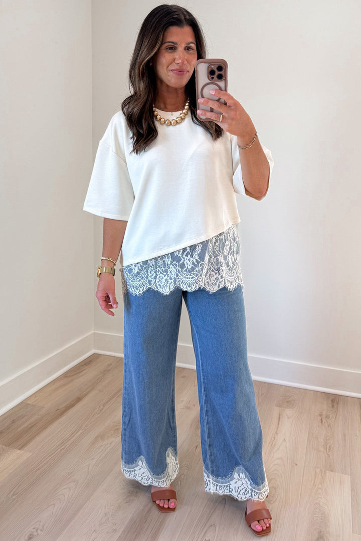 feminine solid ecru asymmetrical tiered lace hem short sleeve crew neckline top