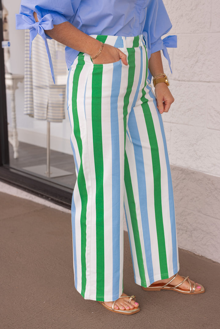 Side view ofomen's blue and green striped wide leg twill denim pants