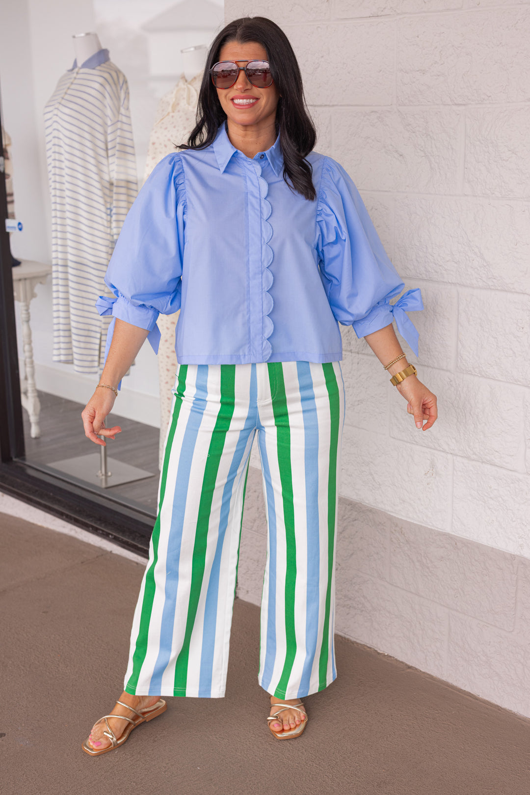 Women's blue and green striped twill denim paired with a blue button up blouse