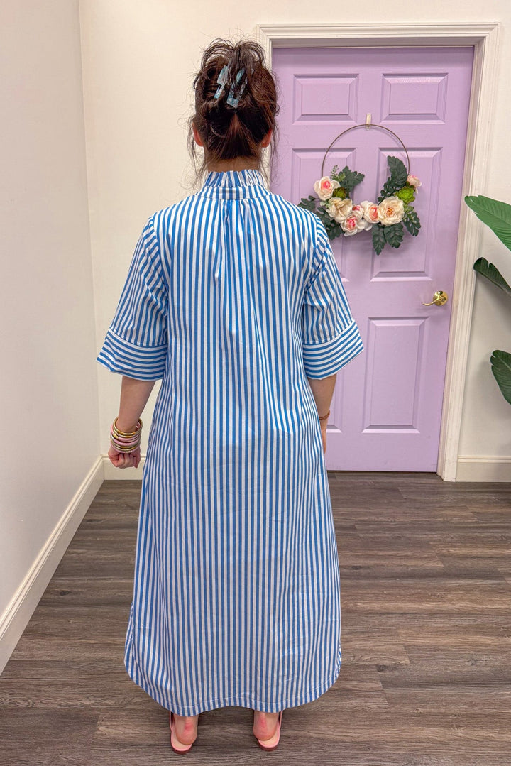 Back view of blue and white striped midi dress
