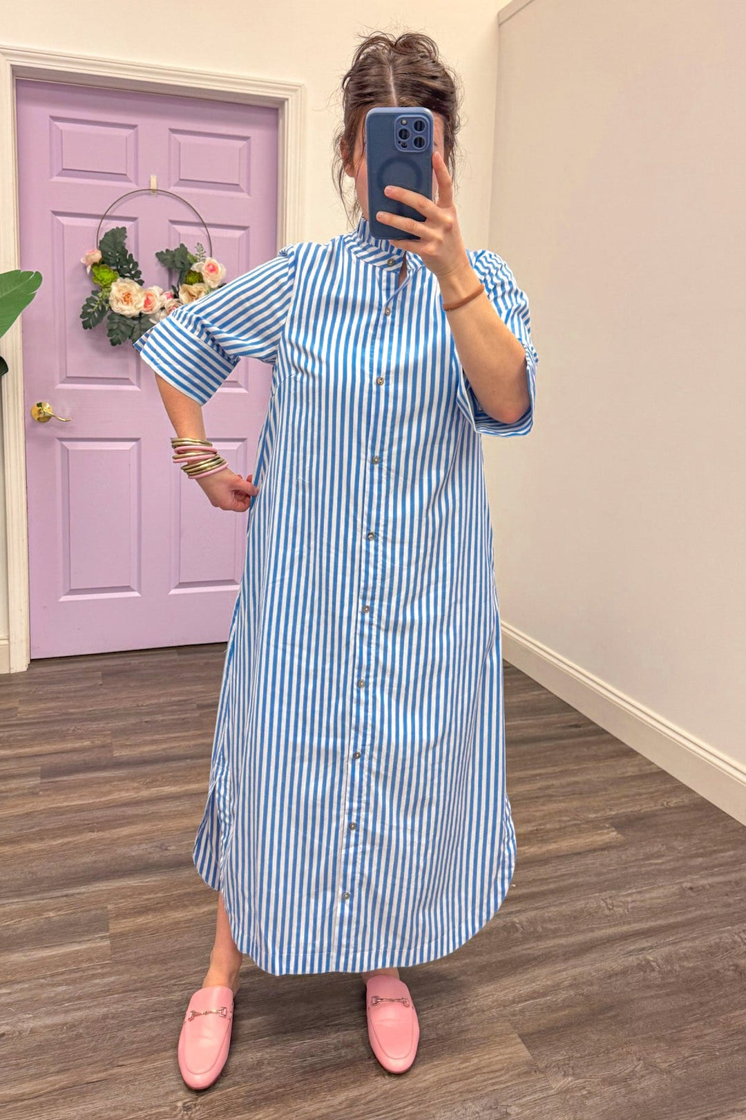 showing the fit of Women's blue and white striped midi dress 