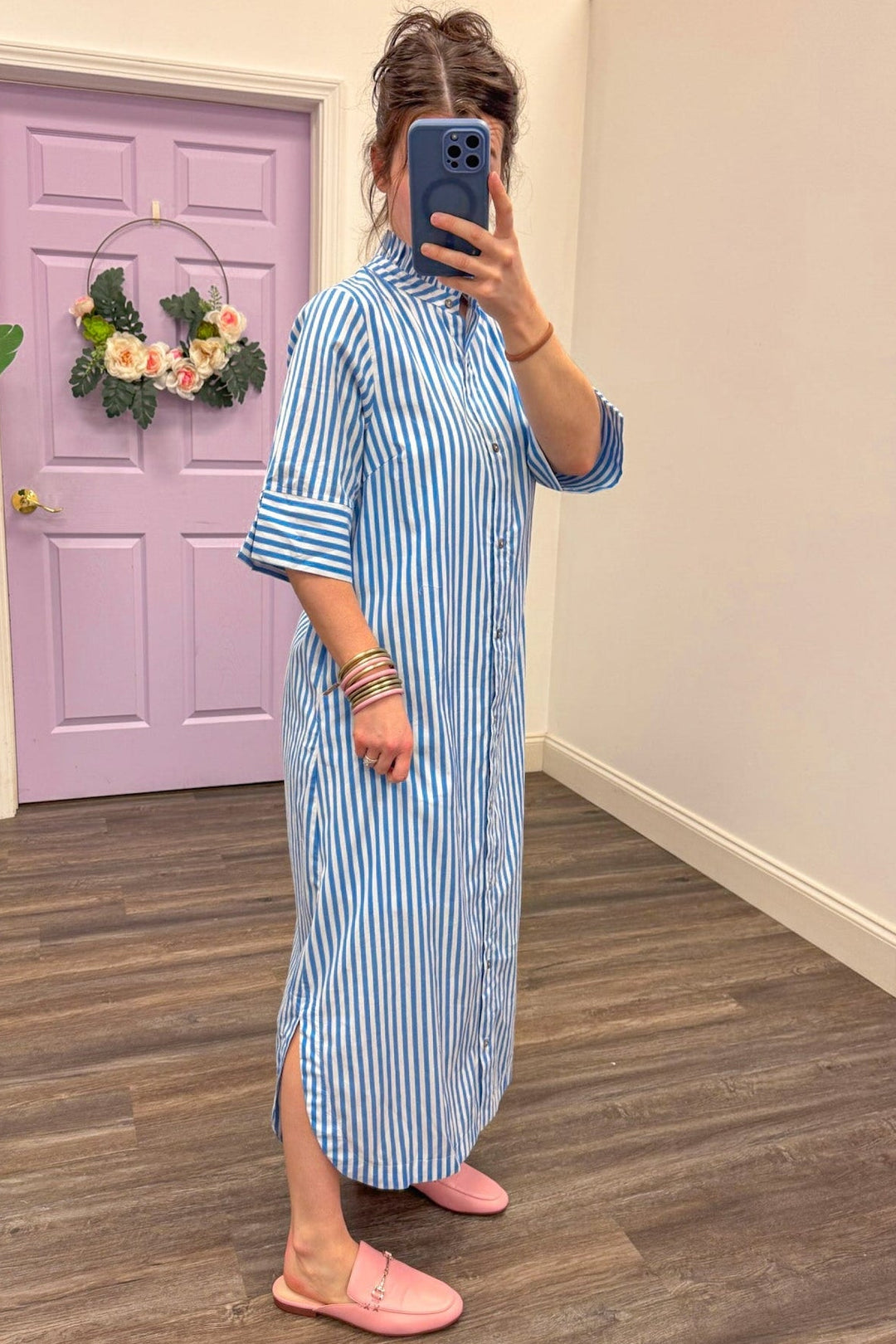 side view of Women's blue and white striped midi dress 