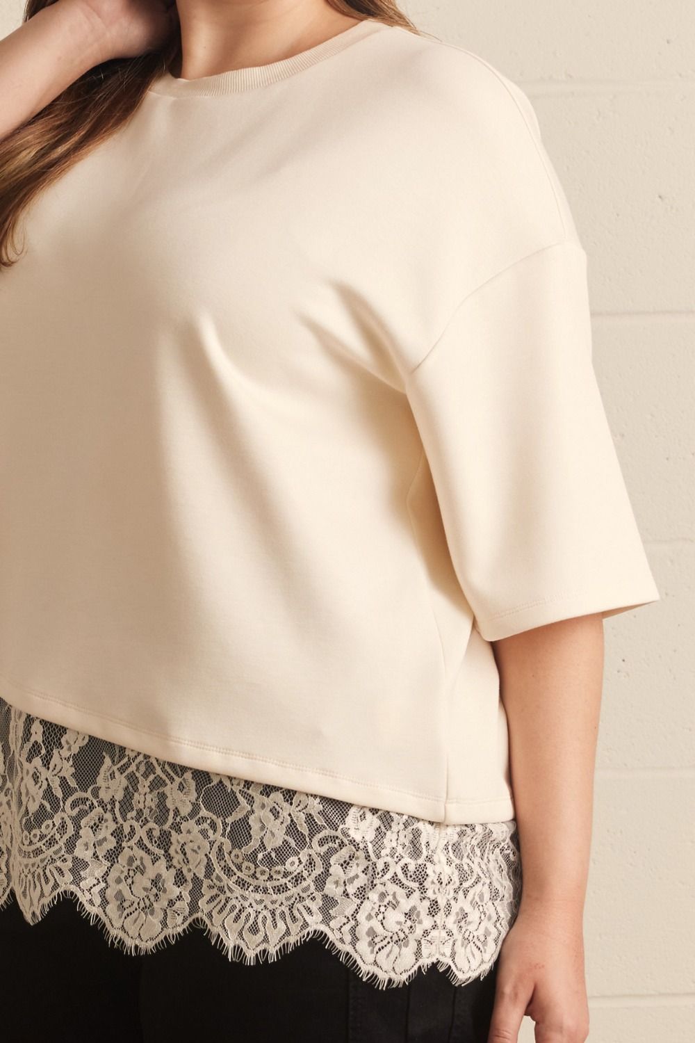 feminine solid ecru asymmetrical tiered lace hem short sleeve crew neckline top plus size