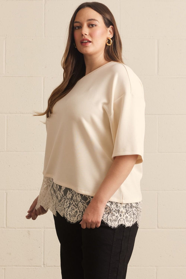 solid ecru asymmetrical tiered lace hem short sleeve crew neckline relaxed silhouette top plus size