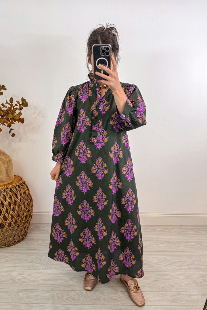 entro fall olive green floral midi dress holding out