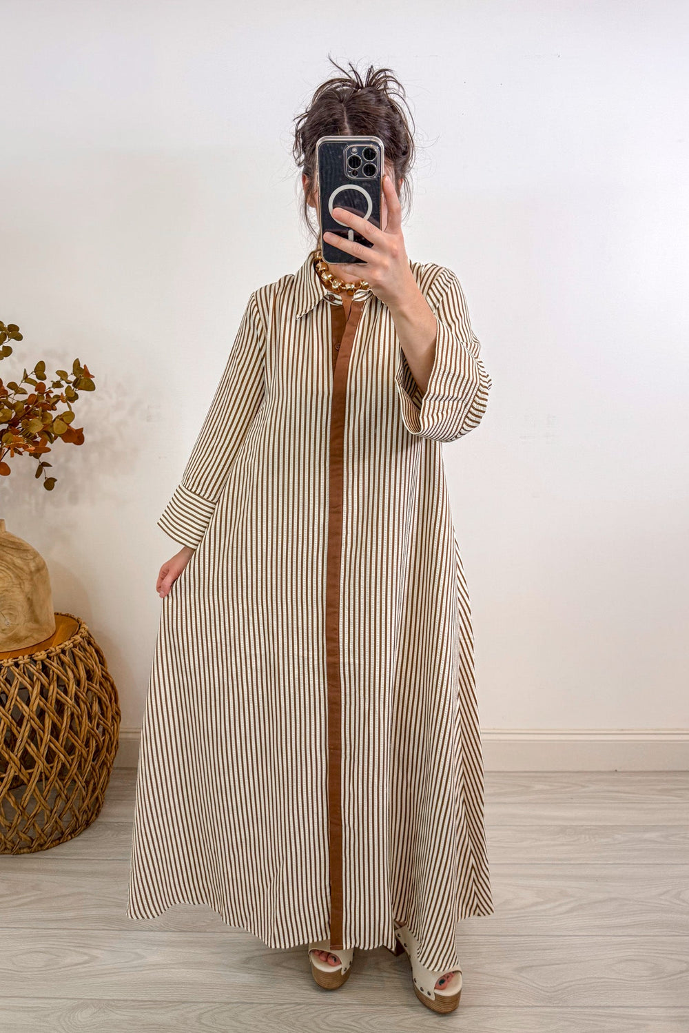 entro striped caramel tan maxi dress holding out 