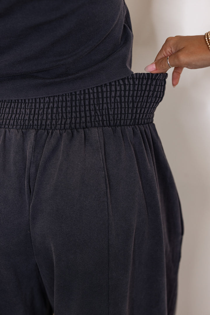 Women's ash black barrell pants and short sleeve top set by ee:some showing elastic waistband