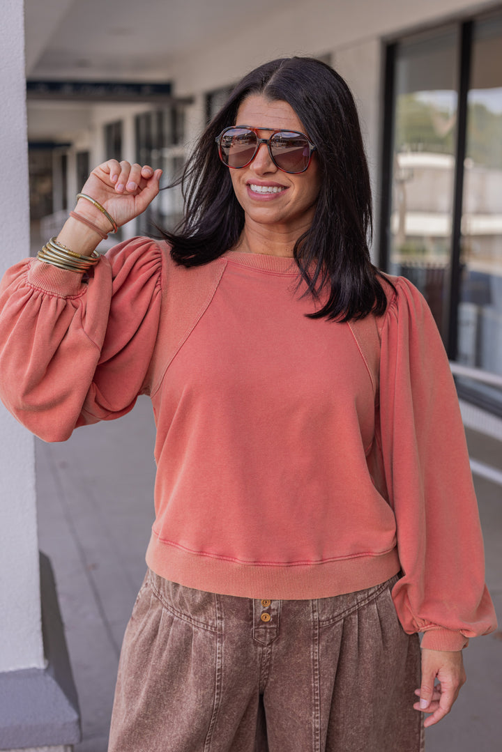 Mineral washed rust balloon sleeve pullover sweatshirt with ribbed details by Jodifl showing up close front view