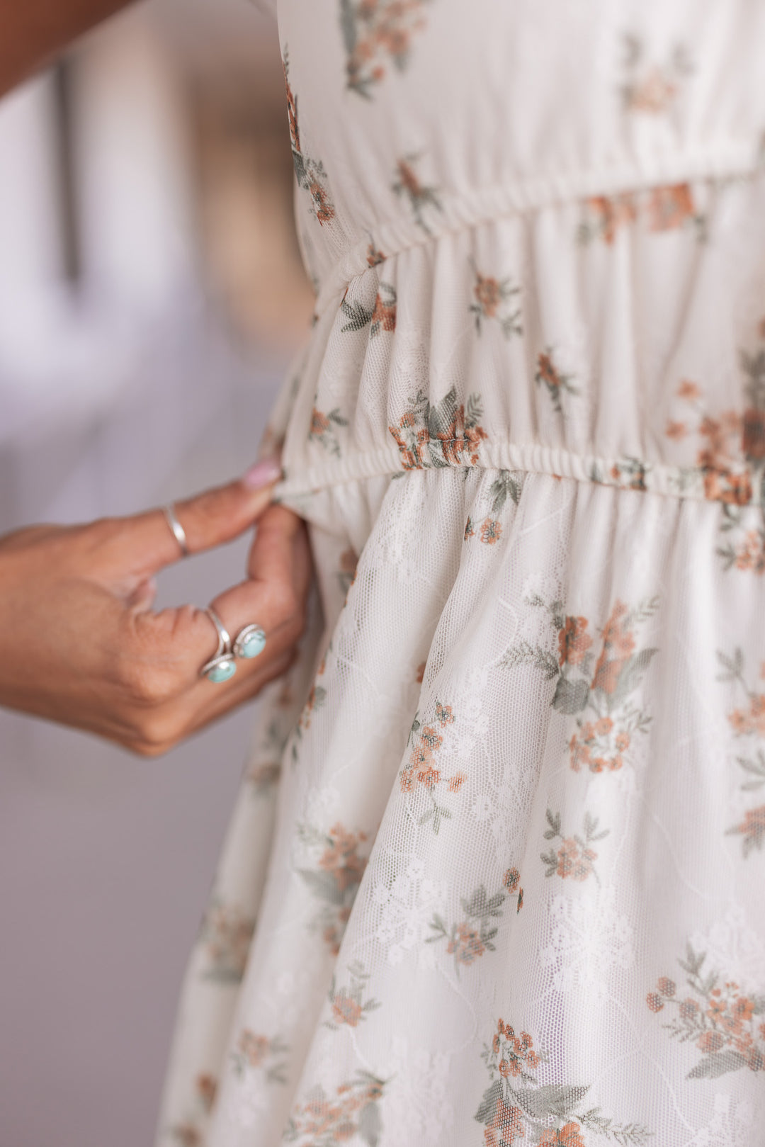 Women's cream midi dress with mustard and olive floral print sheer overlay by Blu Pepper showing ruched elastic waistband