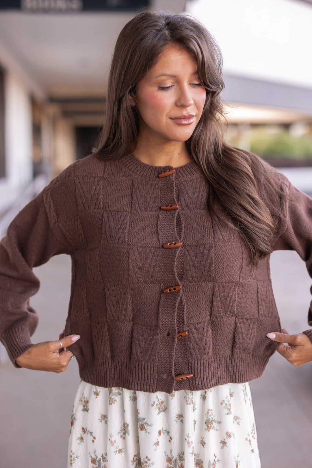 Women's brown knit monochrome checkered button front sweater cardigan by Blu Pepper showing true to size fit