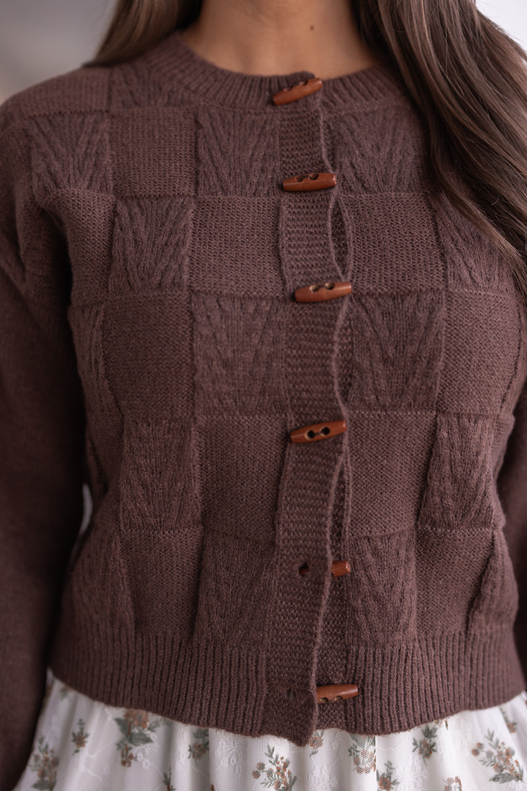 Women's brown knit monochrome checkered button front sweater cardigan by Blu Pepper showing button front closures