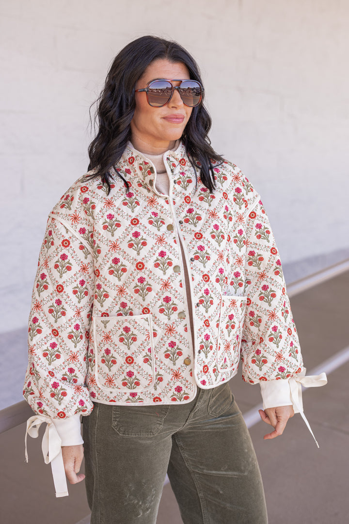 Women's ivory, red and olive floral quilted puffer jacket with bow tie detail sleeves by &merci