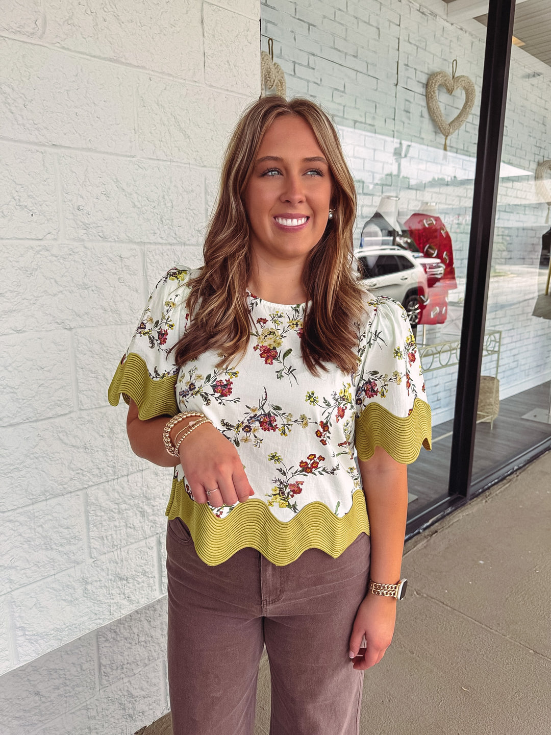 Women's ecru multicolor floral print top with moss green scalloped trim by Entro