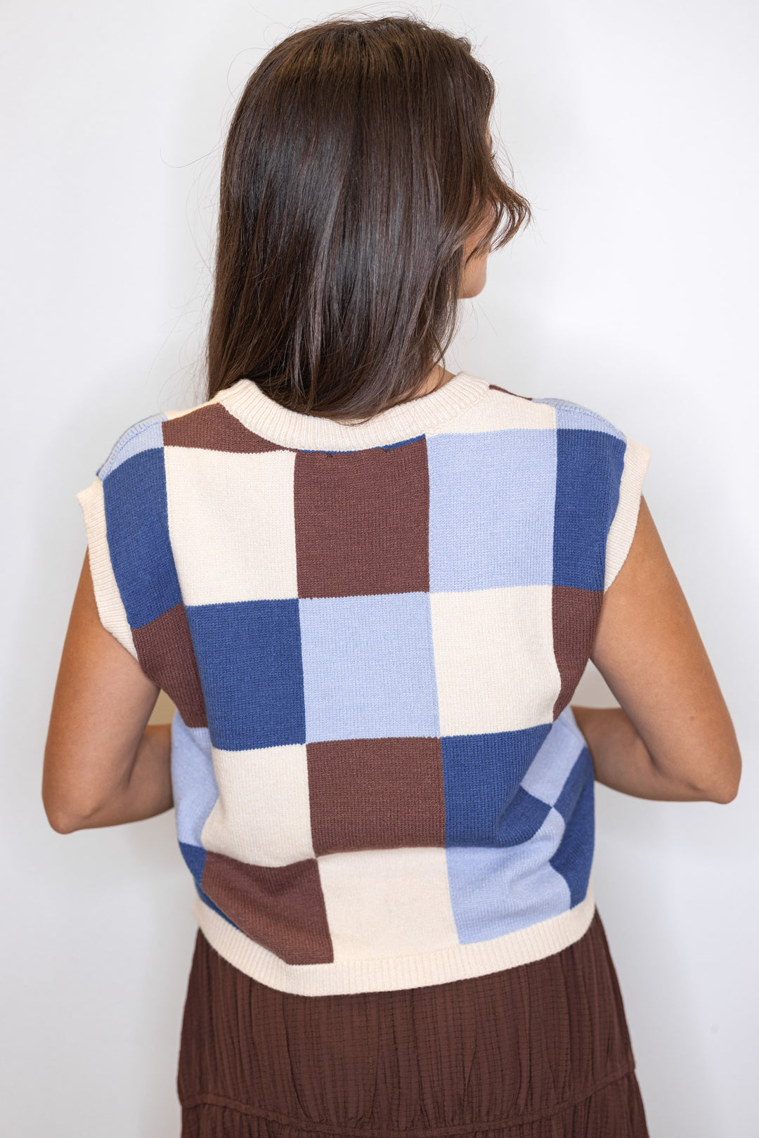 Women's blue, brown and cream checkered knit top with capped sleeves by ee:some showing up close back view