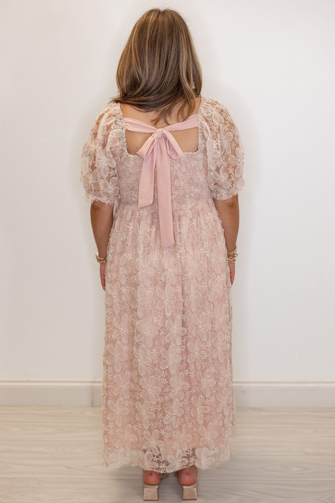 Women's dusty pink floral midi dress with sequins and gold metallic details by In February showing full back view