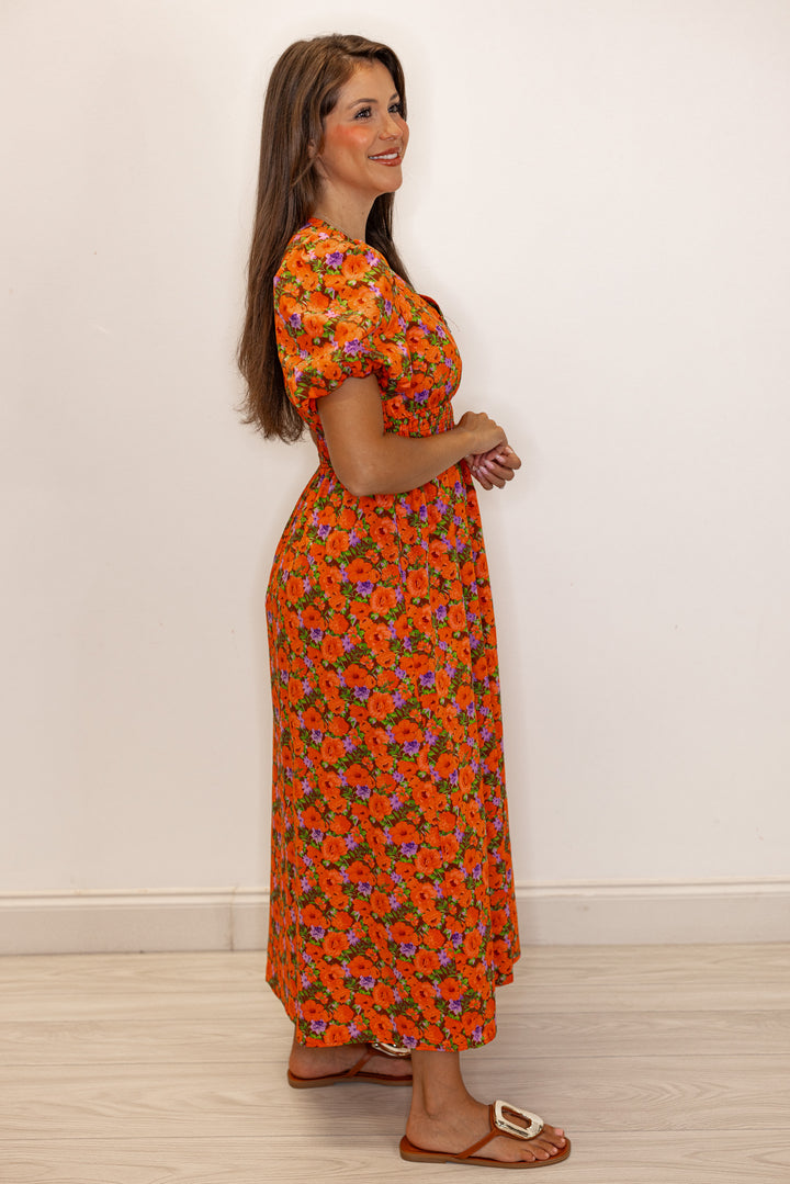 Women's zipper front midi dress with rust, brown and purple floral print by Fantastic Fawn showing full side view