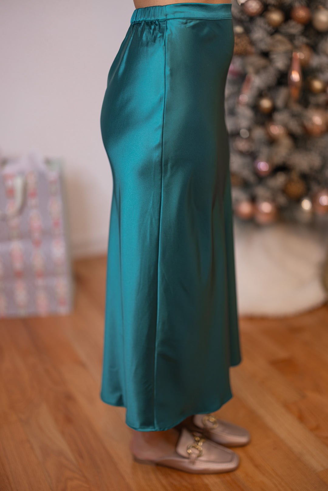 Women's green satin midi skirt by Wishlist showing side view