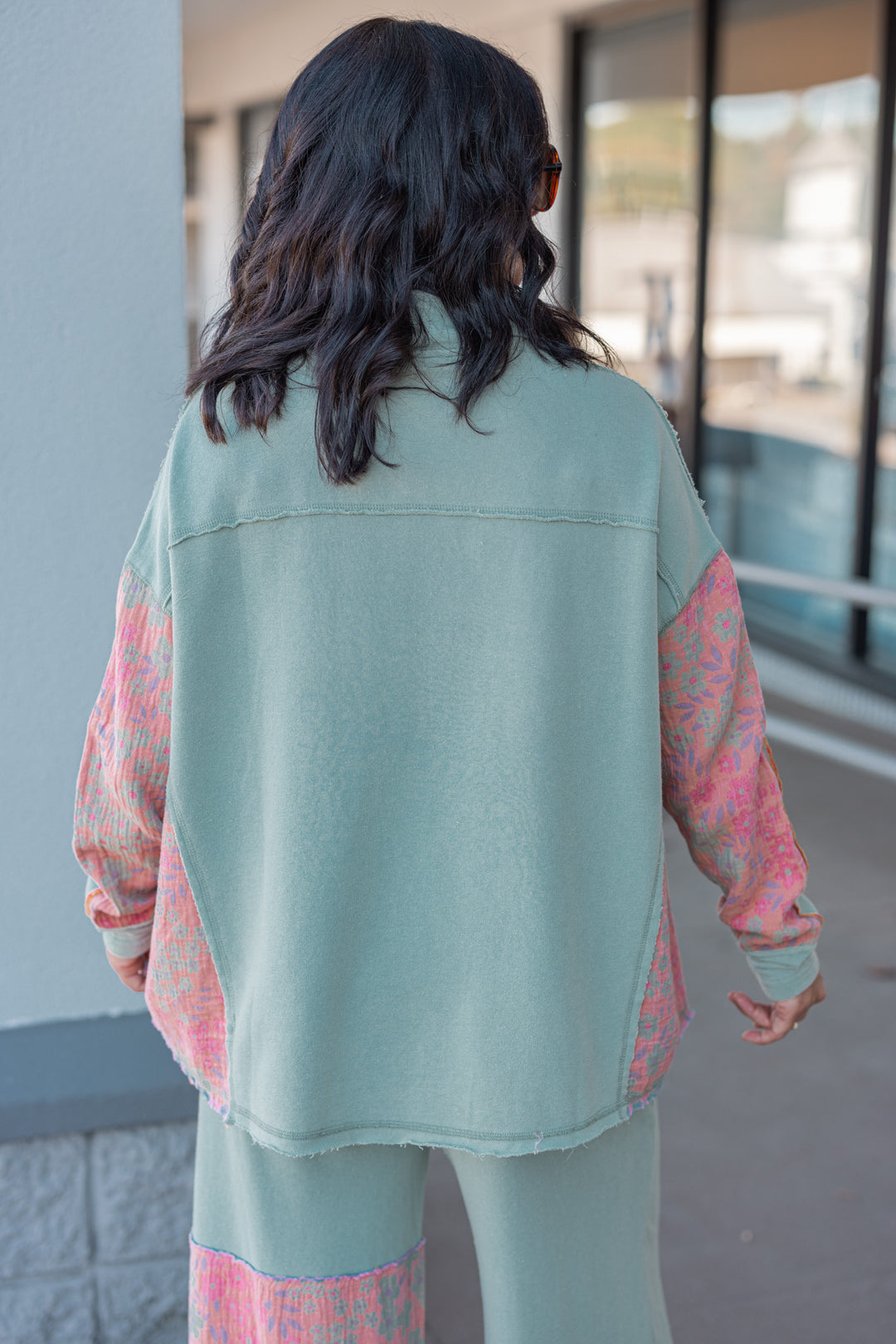 Women's french terry knit sage pullover top with frayed floral patch gauze details by Easel showing back view