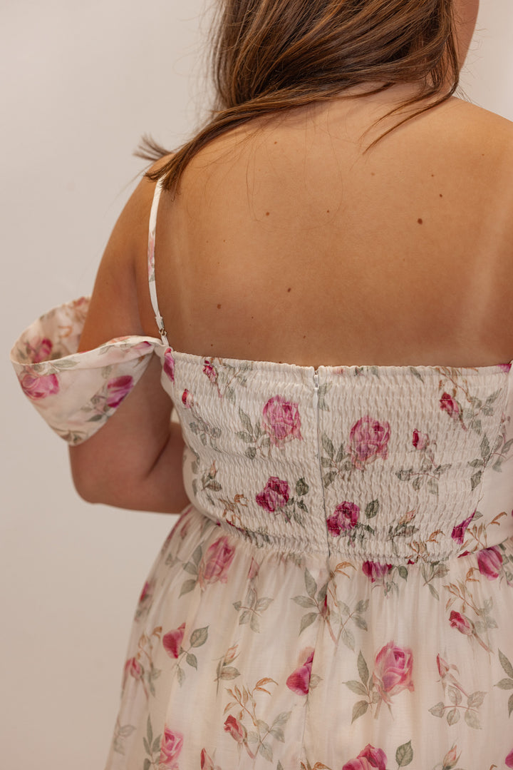 Off white with pink floral print event dress for women and teens. Back view shown