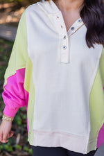 pink lime green color block pullover