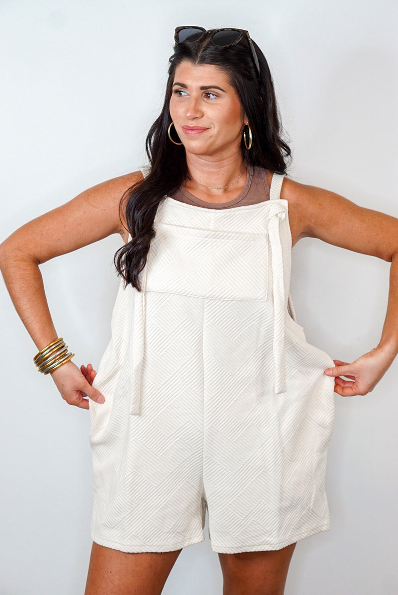 cream textured pinafore romper