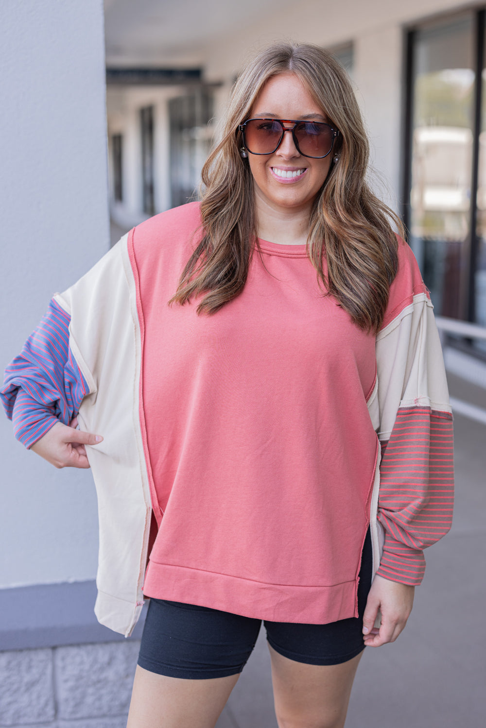 Women's dark coral and taupe terry knit pullover top with stripe details by Easel showing relaxed fit