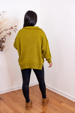 green ribbed knit quarter zip sweater