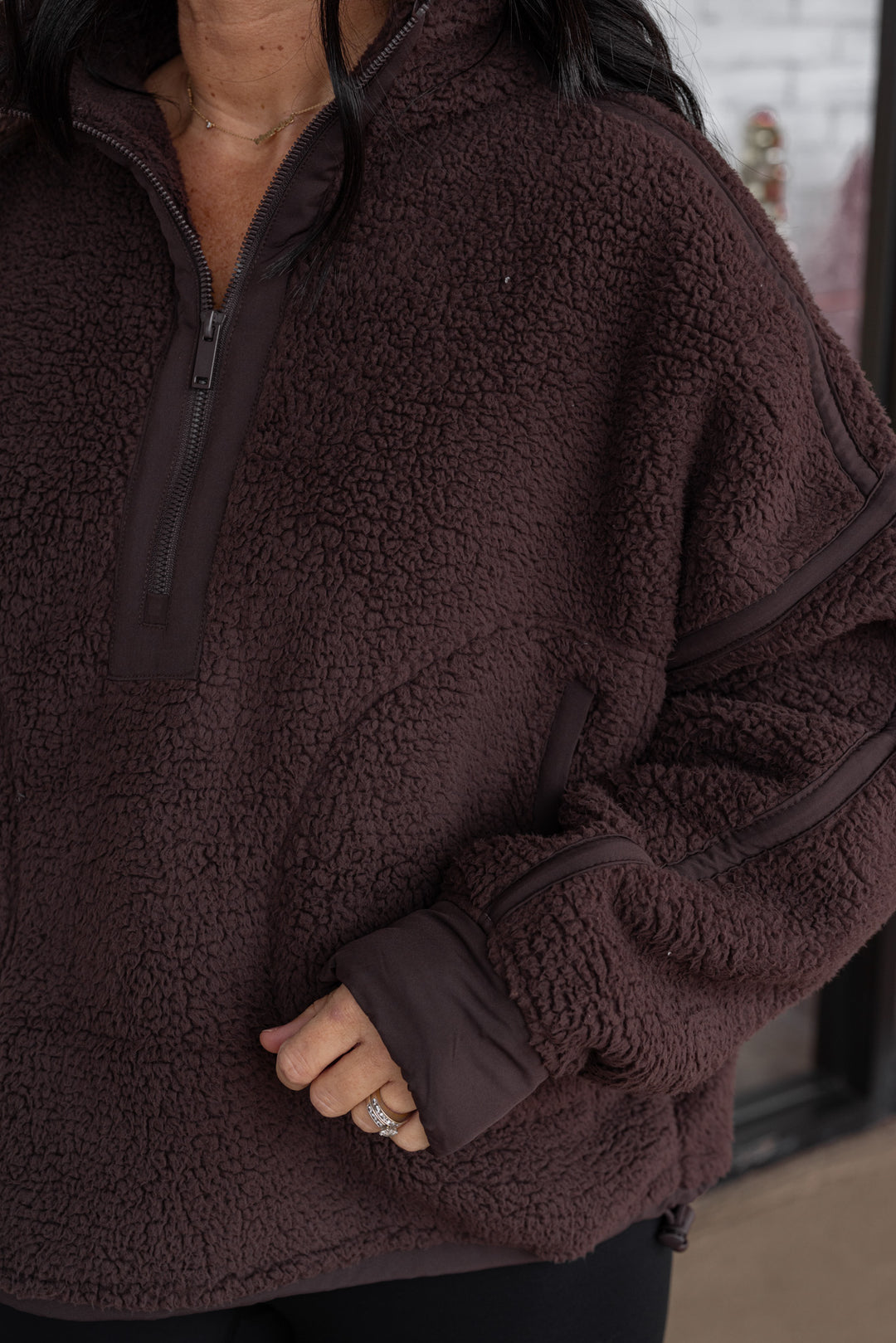 Women's espresso sherpa quarter zip pullover jacket with espresso trim by Rae Mode showing sleeve details