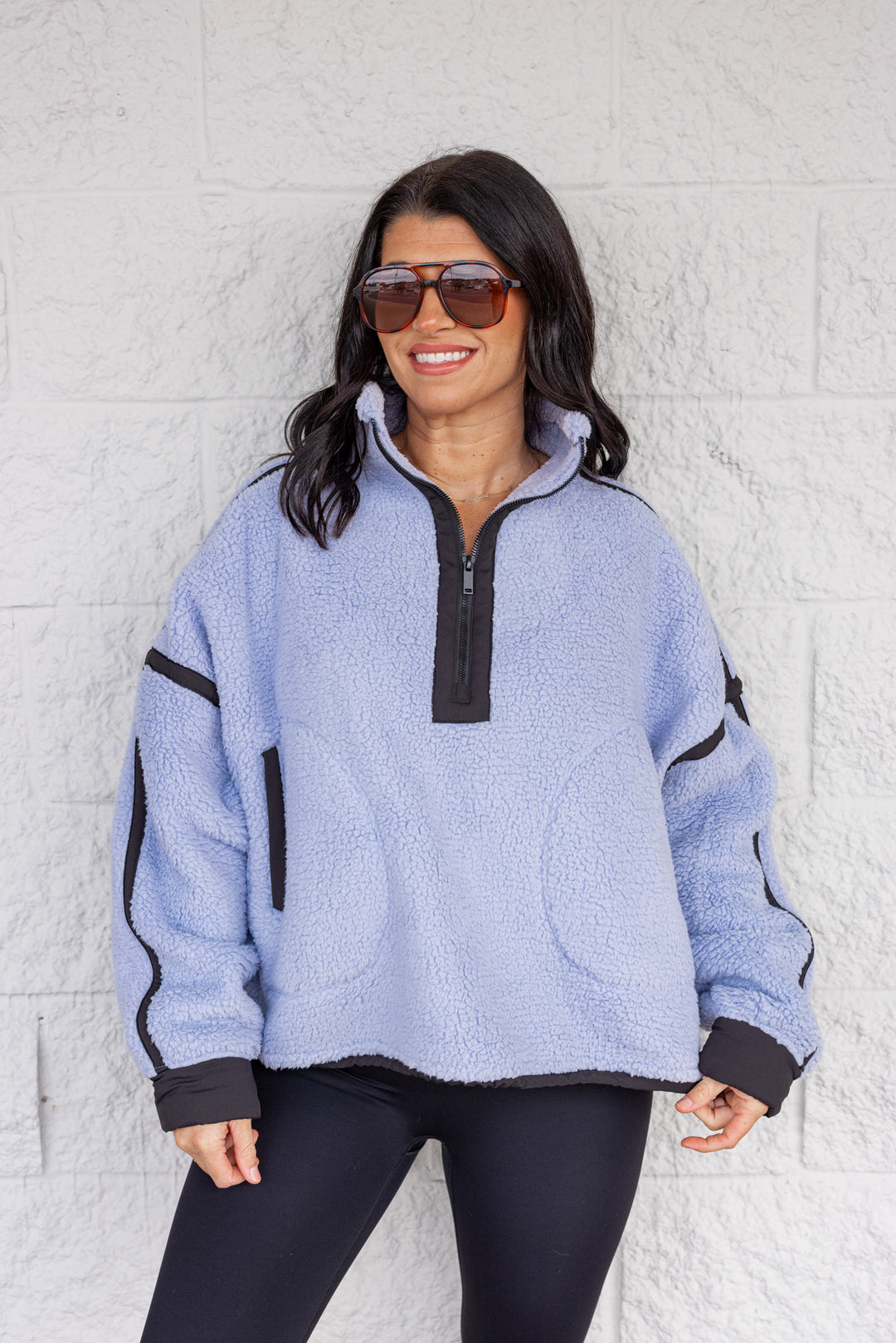 Women's bluish lavender sherpa quarter zip pullover jacket with black trim by Rae Mode
