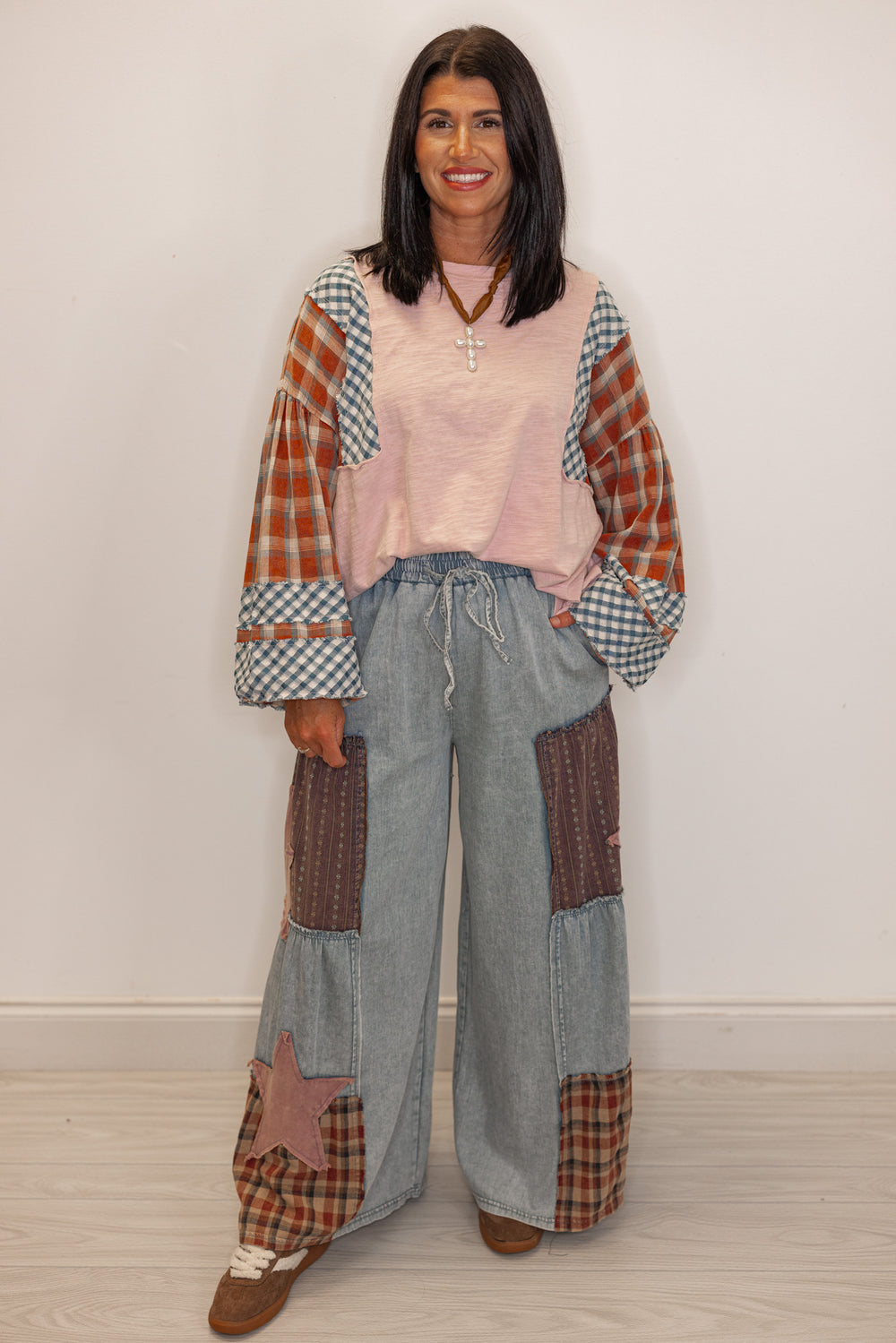 Women's Patchwork wide leg jeans with a star design paired with a light pink and plaid tee
