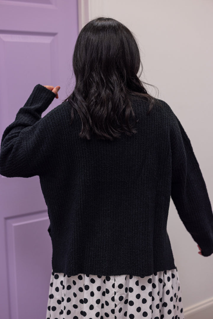 Women's black ribbed knit mock neck sweater top with side slits by Mustard Seed showing up close back view