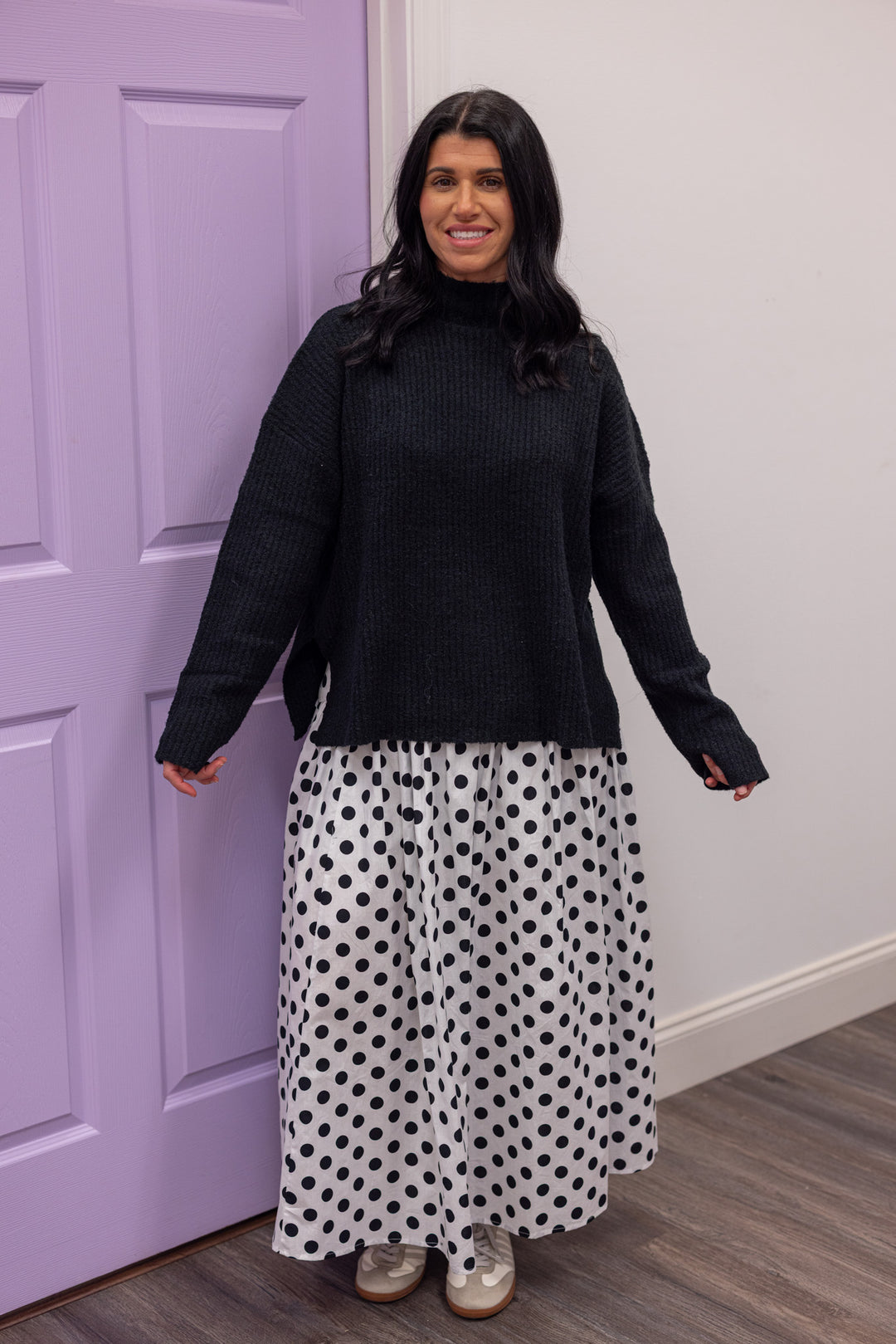 Women's black ribbed knit mock neck sweater top with side slits by Mustard Seed showing full front view