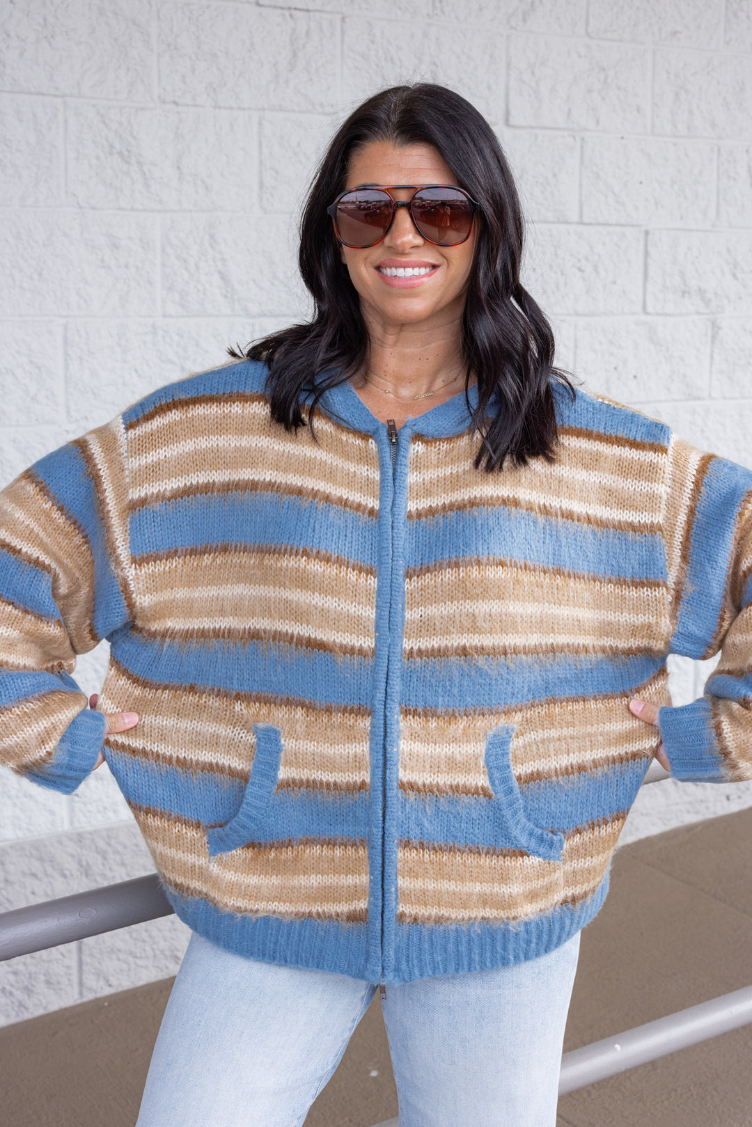Women's blue and tan striped sweater knit jacket with a zipper front and hood by Mustard Seed showing relaxed silouhette